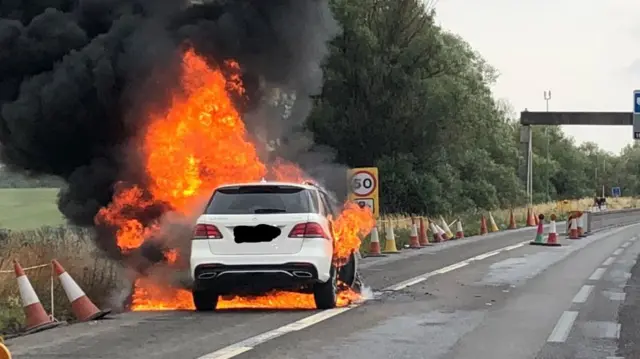 Car on fire on M6