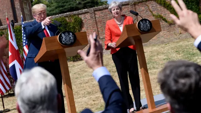 US President Donald Trump (L) and Britain"s Prime Minister Theresa May hold a joint press conference following their meeting at Chequers, the prime minister"s country residence, near Ellesborough, northwest of London on July 13, 2018 on the second day of Trump"s UK visit.