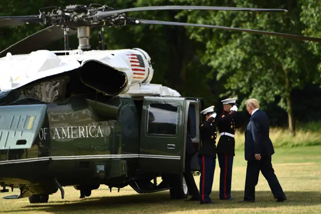 Donald Trump boards a helicopter