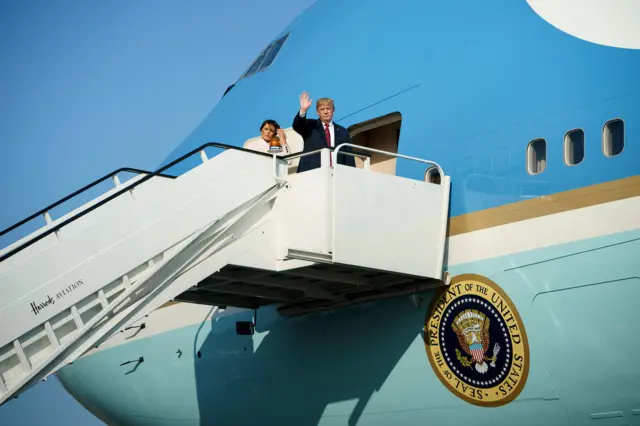 US President Donald Trump and US first lady Melania Trump board Air Force One