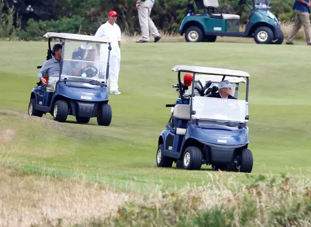 Donald Trump in golfing buggy