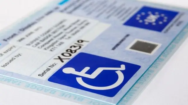 A stock picture of a blue badge