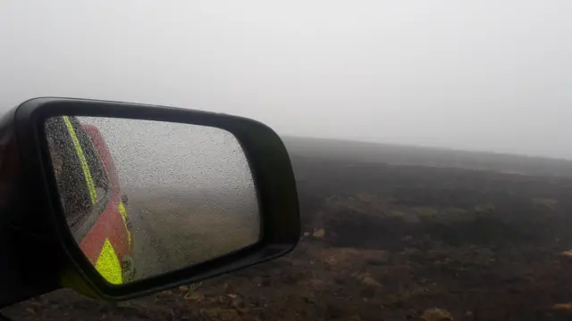 Fire vehicle on burnt grass