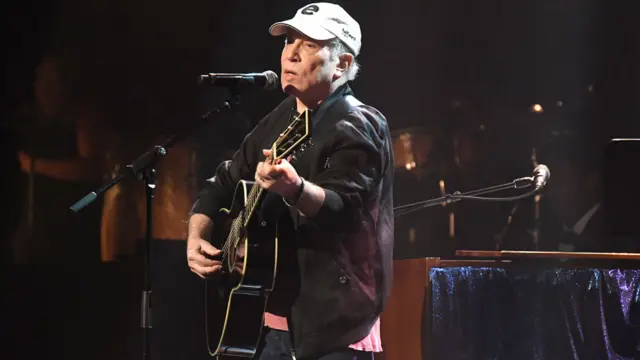 Paul Simon performing in New York in April