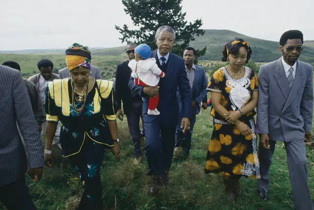 Winnie and Nelson Mandela with their grandson Bambatha, daughter Zenzekile 'Zinzi' Mandela, and son-in-law Zweli Hlongwane, during their visit to Urandela's ancestral village and birthplace for first time after his release from jail.