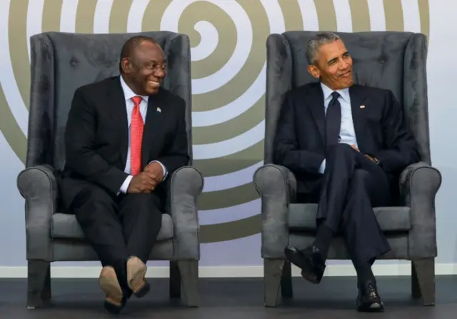 Former US President Barack Obama (R) and South African President Cyril Ramaphosa (L) attend the 2018 Nelson Mandela Annual Lecture at the Wanderers cricket stadium in Johannesburg on July 17, 2018