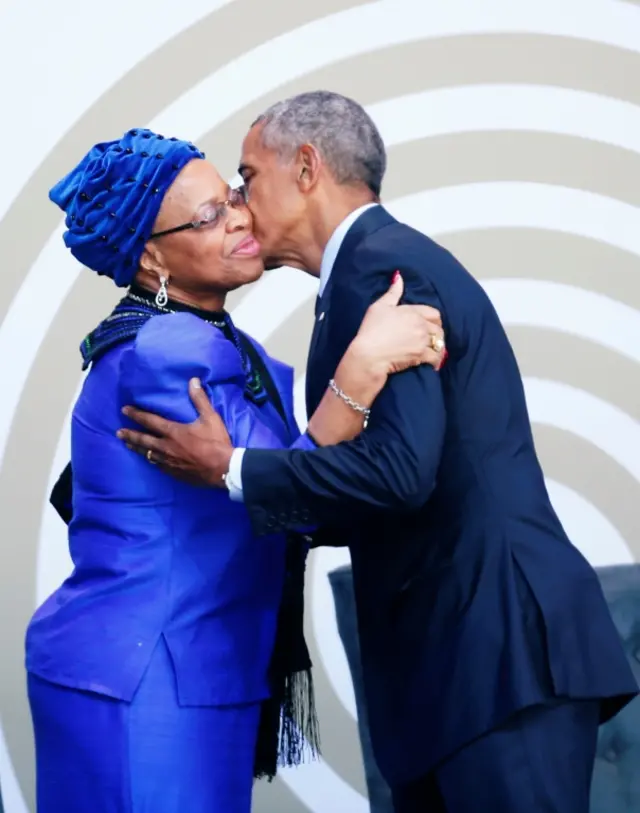 Former U.S. President Barack Obama greets Nelson Mandela"s widow Graca Machel as he arrives to deliver the 16th Nelson Mandela annual lecture in Johannesburg, South Africa July 17, 2018.