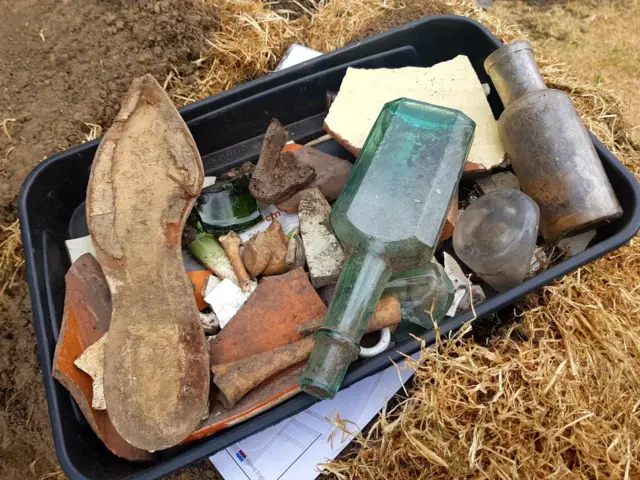 Some of the finds including bottles and bones