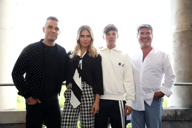 Robbie Williams, his wife Ayda, One Direction's Louis Tomlinson and Simon Cowell