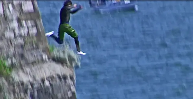 Man jumping from cliff in Plymouth