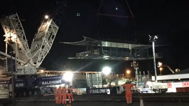 Footbridge span being lifted