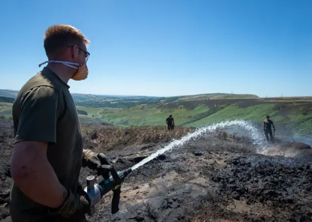 Army putting out the fire