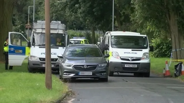 Police cordon off a grassed area near Dane Park Road in Hull