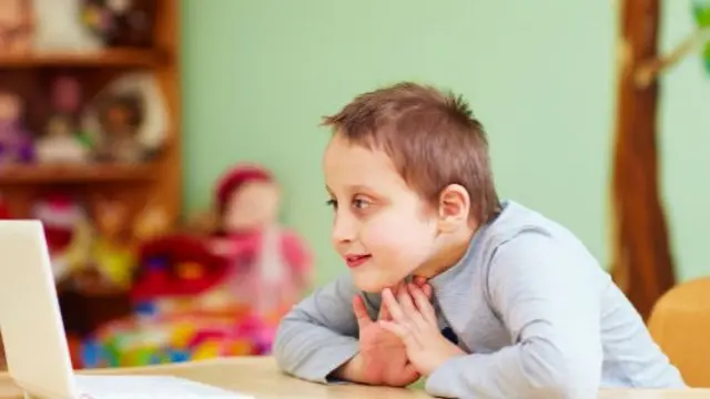 A child looking at a computer