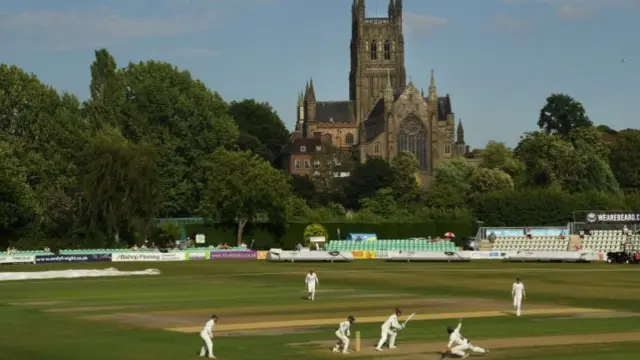 A general view of the Somerset opening batsmen compiling their partnership in view of Worcester cathedral