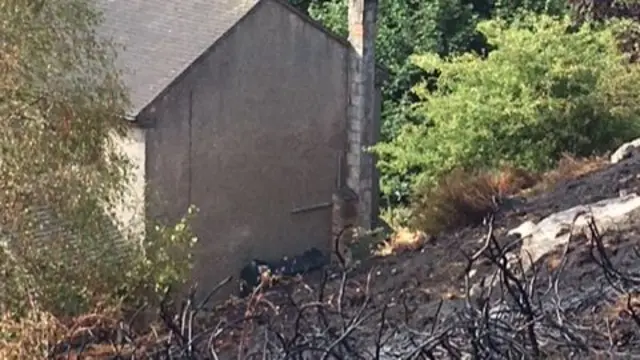 Photo showing how close the blaze got to a house