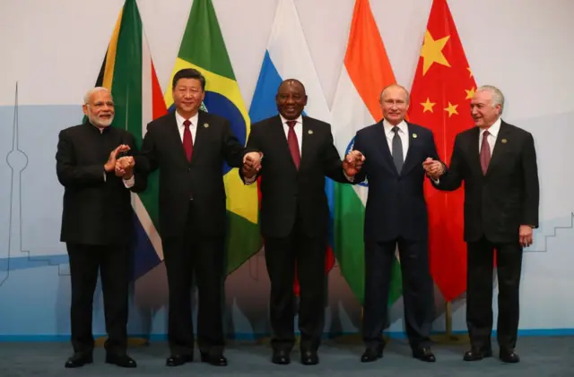 (LtoR) India's Prime Minister Narendra Modi, China's President Xi Jinping, South Africa's President Cyril Ramaphosa, Russia's President Vladimir Putin and Brazil's President Michel Temer pose for a group picture during the 10th BRICS summit.