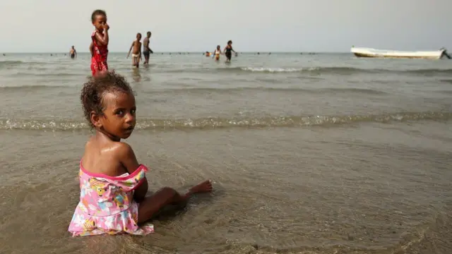 A girl plays at the beach in Massawa, a city on the Red Sea coast of Eritrea, on Sunday...