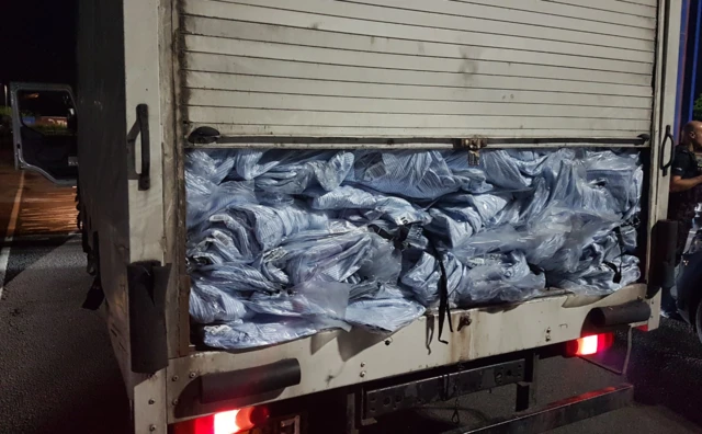 Clothes in back of lorry