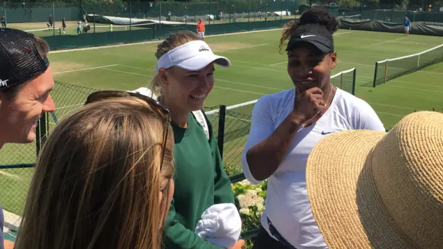 Caroline Wozniacki and Serena Williams talking at Wimbledon