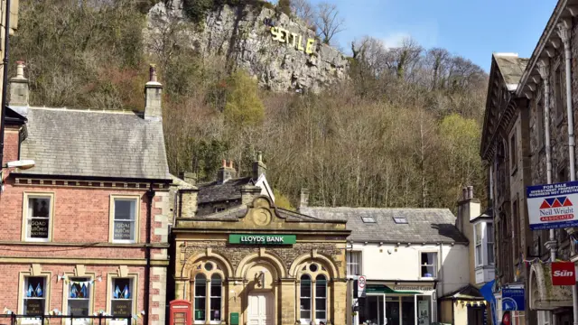 Letters above the town spelling out 'Settle'