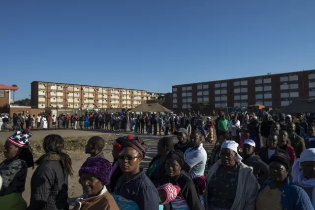 Members of the public queue at a polling station to cast their vote in the Zimbabwean General Election on July 30, 2018 in Harare, Zimbabwe