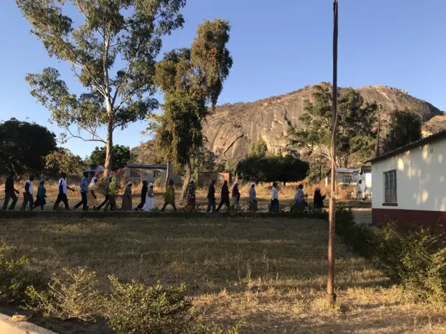 Voters stand in line