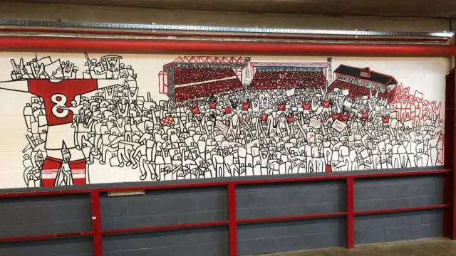 The red and white mural showing Oakwell