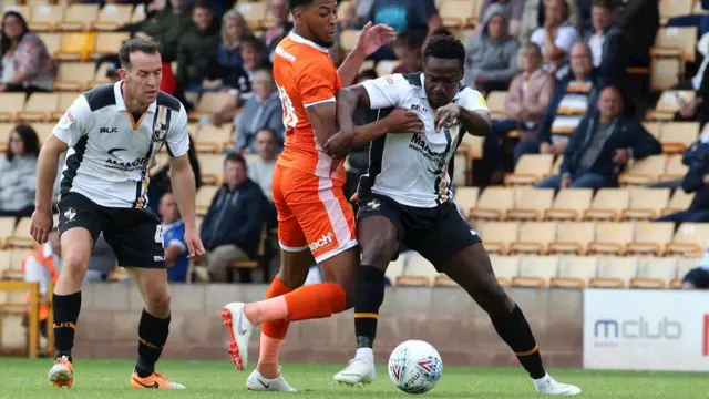 Port Vale's new midfielder Manny Oyeleke playing, right, in recent friendly