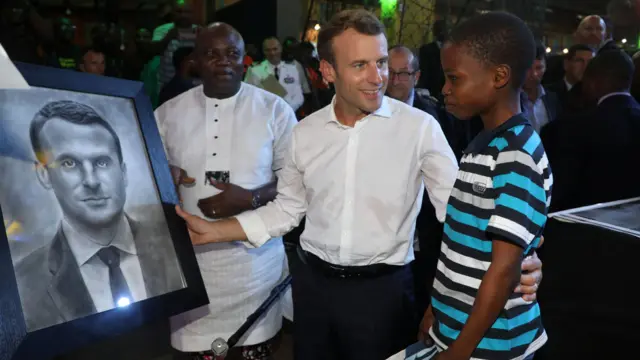 Emmanuel Macron with Kareem Waris Olamileka