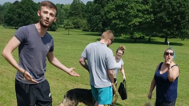 People in the park with a dog