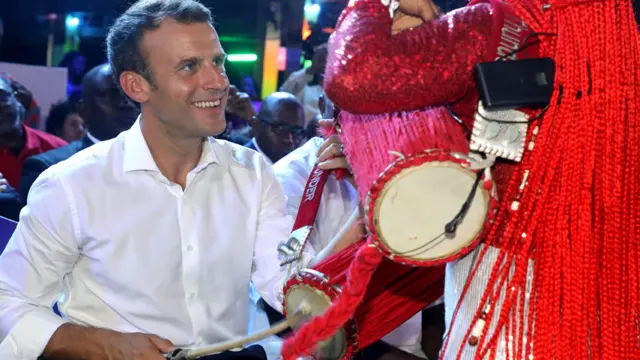 President Macron playing a drum