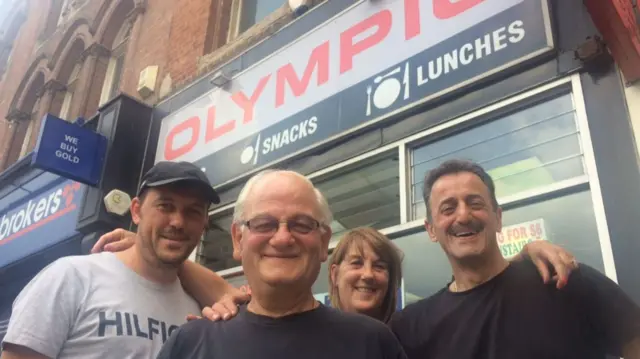 Owner George Nicholaides and staff outside the Olympic Coffee House in Leeds