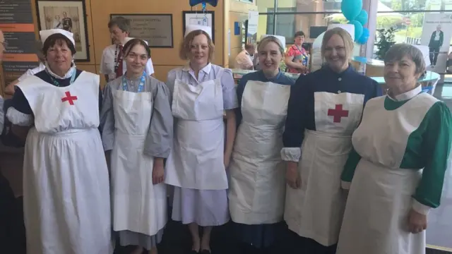 Staff dressed as old fashioned nurses