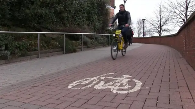 Man riding an ofo bike