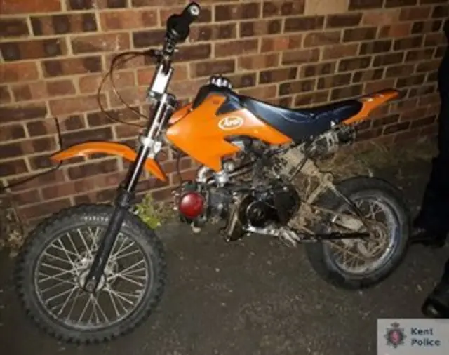 A yellow and black motorbike