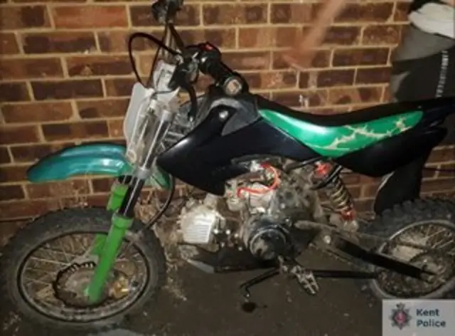 A green and black motorbike