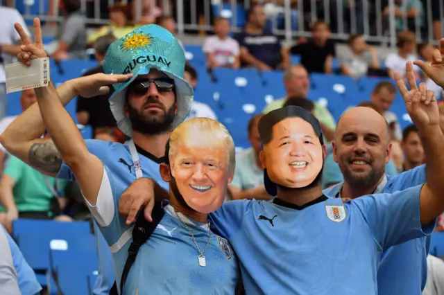 Uruguay/Donald Trump and Kim Jong-Un fans at the World Cup