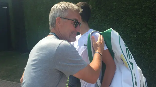 Novak Djokovic hugs Fredrik Rosengren