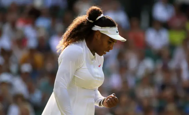 Serena Williams clenches a fist