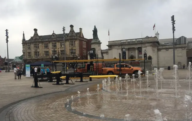 The fountains in Queen Victoria Square with an assault course in the background.