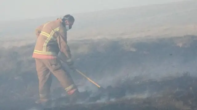 firefighters on moorland near bolton