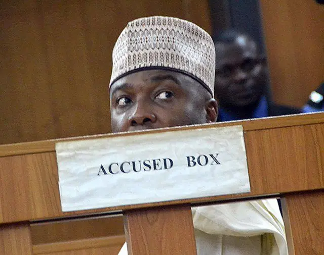 Nigerian Senate President Bukola Saraki sits in the accused box during a hearing of corruption charges against him at Code of Conduct tribunal in Abuja, on September 22, 2015