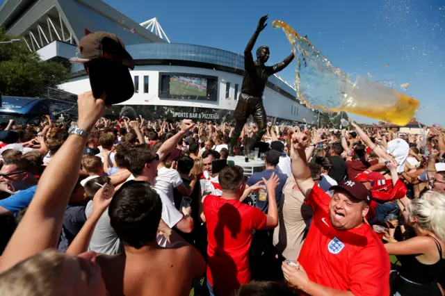 England fans celebrate Alli's goal