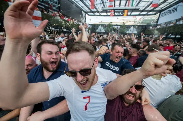 England fans celebrate Alli's goal