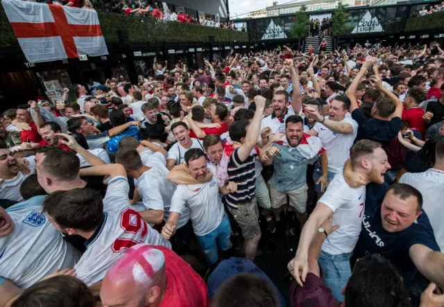 England fans celebrate Alli's goal