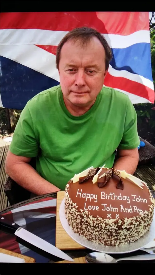 man with birthday cake