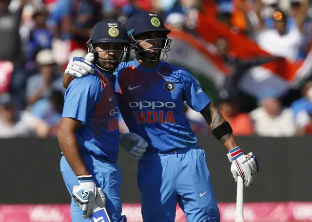 Rohit Sharma celebrates with India's captain Virat Kohli