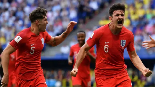 England's Harry Maguire celebrates after scoring the opening goal in England's win over Sweden