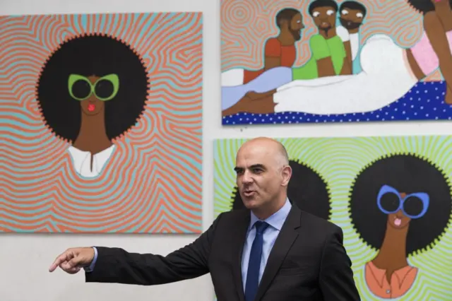 Swiss Federal President Alain Berset visits an artist studio at the GoDown Arts Center, during his official visit in Nairobi, Kenya, 09 July 2018